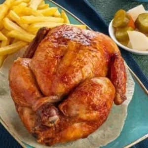 whole chicken machine with hummus, garlic, and potatoes